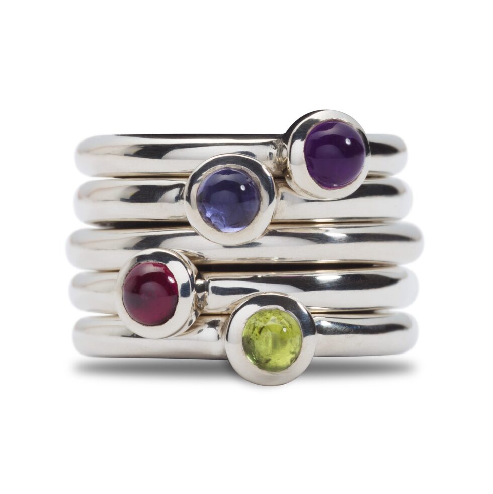These gorgeous rings can be worn on their own, or stacked. They come in a wonderful variety of colours. Garnet (red wine colour), Iolite (navy blue ink colour), Amethyst (purple) and Peridote (green). Unique designer jewellery handcrafted in Ireland.